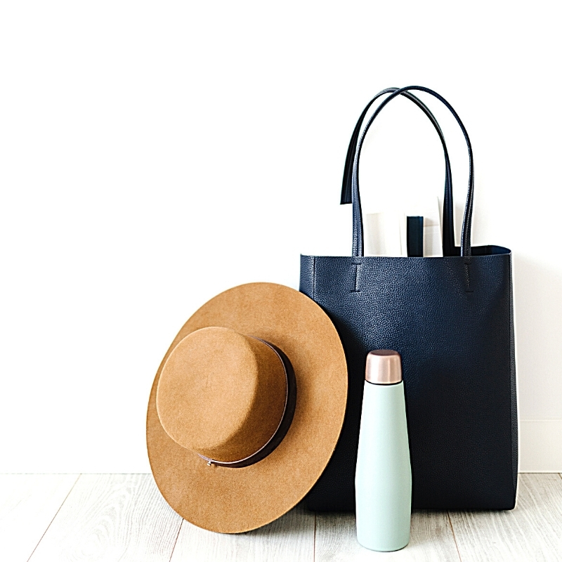 Shopping bag, hat, and water bottle